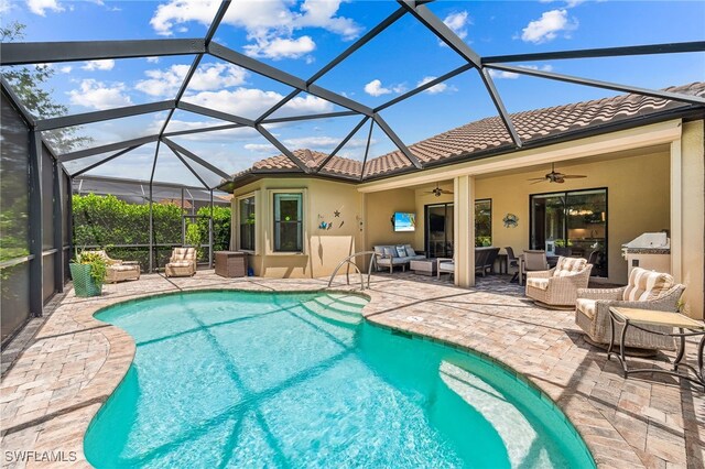 outdoor pool featuring a lanai, a patio area, ceiling fan, and an outdoor living space