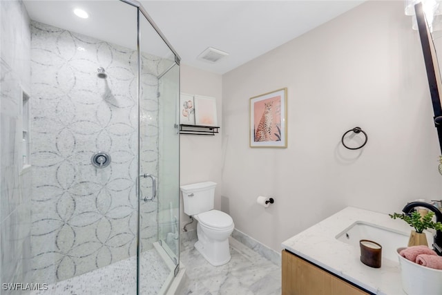 bathroom featuring an enclosed shower, vanity, and toilet