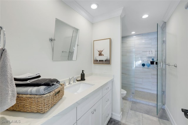 bathroom with tile patterned floors, toilet, a shower with door, ornamental molding, and vanity