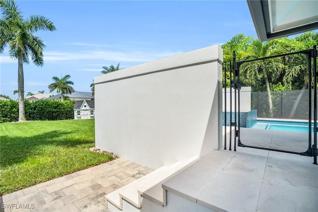 exterior space featuring a fenced in pool