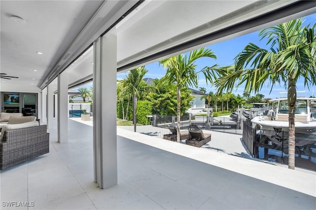 view of patio featuring outdoor dining area and ceiling fan