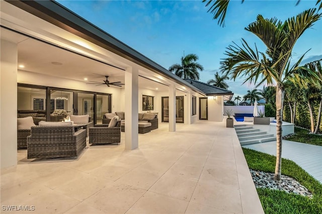 view of patio / terrace with a ceiling fan and an outdoor hangout area