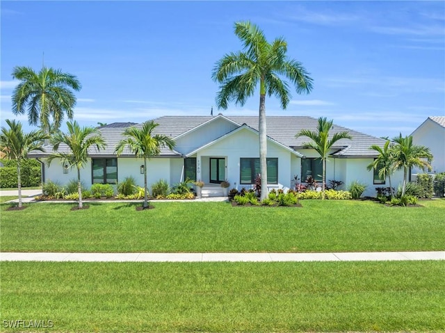 view of front of home featuring a front lawn and stucco siding