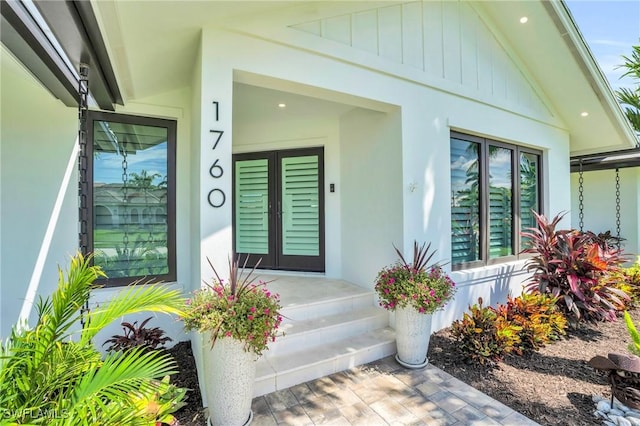 doorway to property with stucco siding and french doors