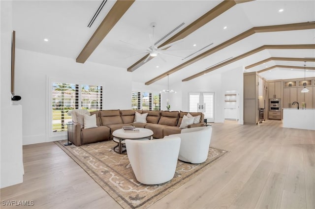 living area featuring light wood-style floors, high vaulted ceiling, beam ceiling, and ceiling fan with notable chandelier