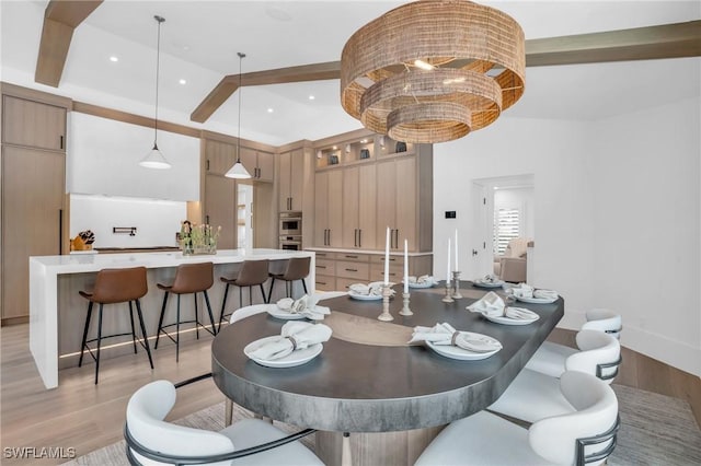 dining area with recessed lighting and light wood-style floors