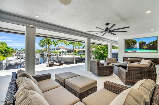 living room with recessed lighting, a ceiling fan, and floor to ceiling windows