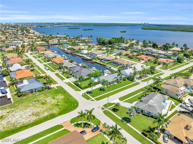 bird's eye view with a water view and a residential view