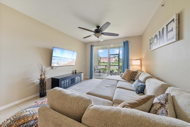 living room with lofted ceiling, light tile patterned flooring, and ceiling fan