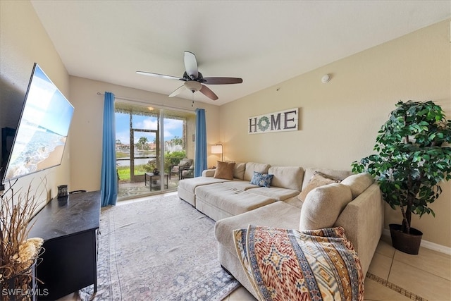 living room featuring ceiling fan and light tile patterned floors