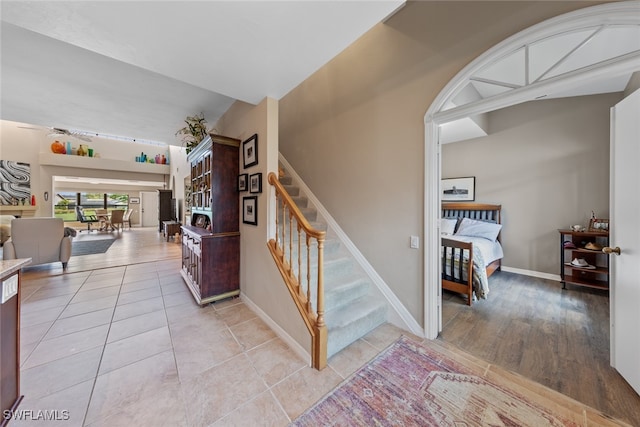 stairway featuring wood-type flooring