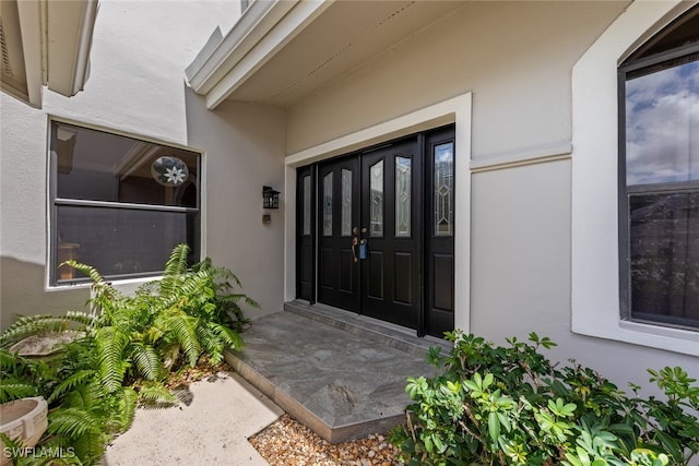 property entrance featuring french doors