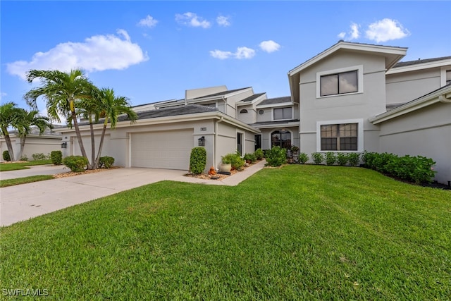 view of front facade featuring a garage and a front lawn