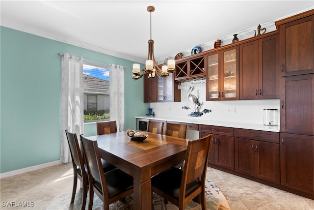 dining space with crown molding and a notable chandelier