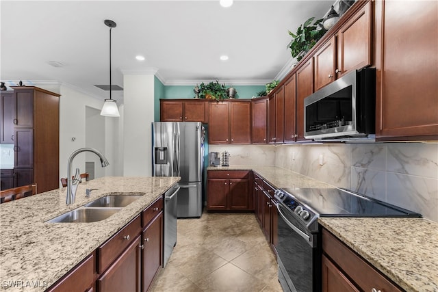 kitchen featuring light stone countertops, stainless steel appliances, crown molding, sink, and decorative light fixtures