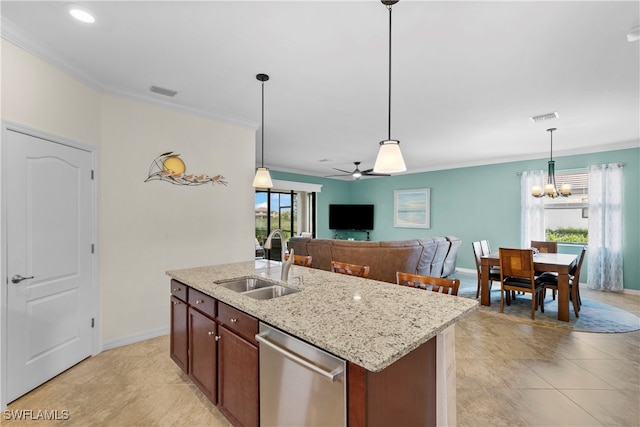 kitchen with dishwasher, a center island with sink, ceiling fan with notable chandelier, sink, and decorative light fixtures