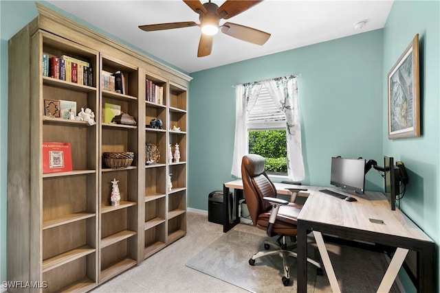 office space featuring ceiling fan and light colored carpet