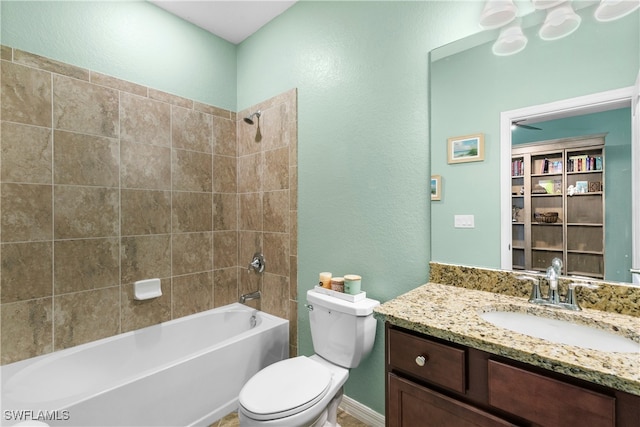 full bathroom with vanity, toilet, and tiled shower / bath