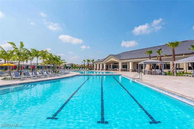 view of swimming pool with a patio