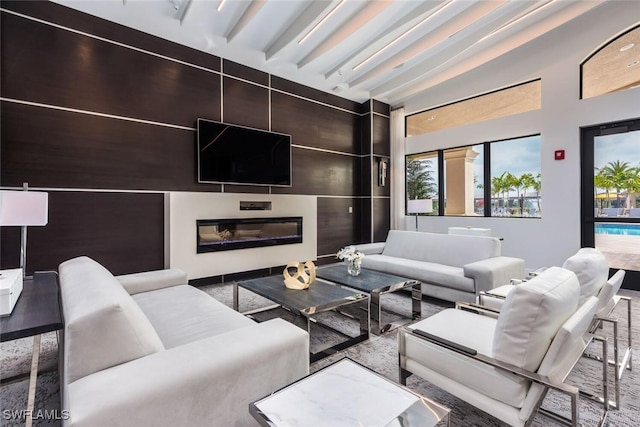 living room with beam ceiling