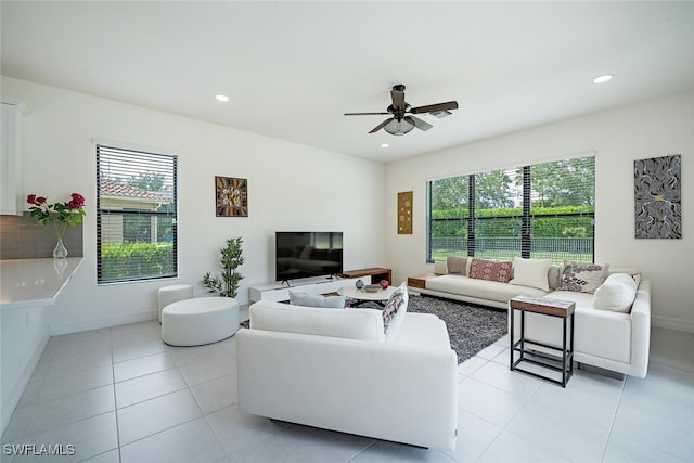 living room with light tile patterned floors and ceiling fan