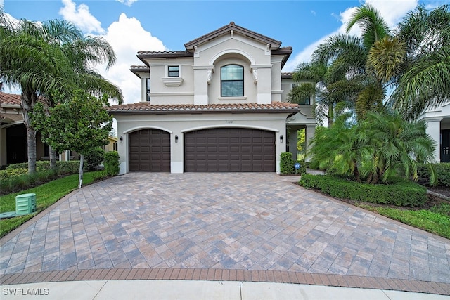 mediterranean / spanish-style home featuring a garage