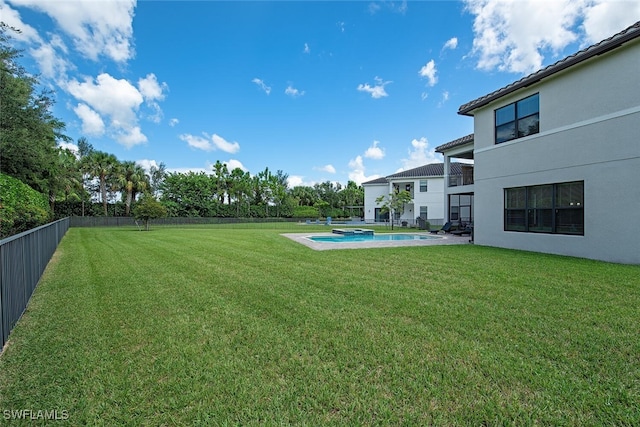 view of yard with a fenced in pool