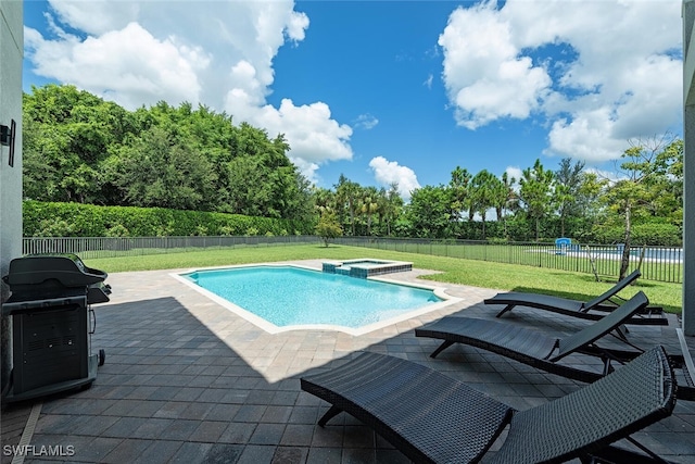 view of swimming pool featuring a patio area, area for grilling, a lawn, and an in ground hot tub