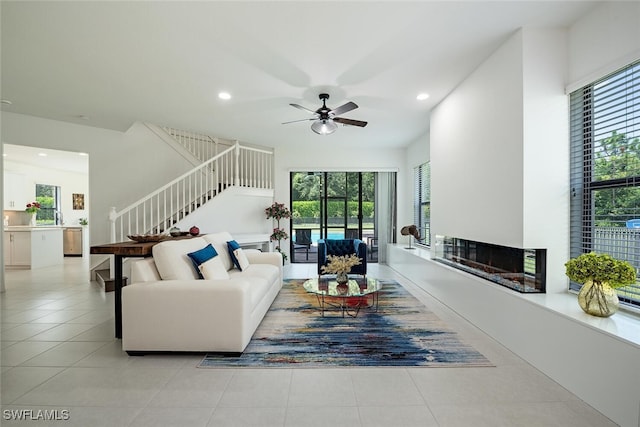 tiled living room featuring ceiling fan