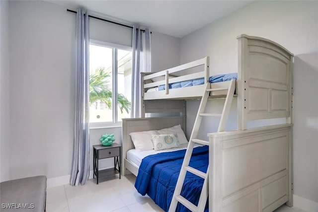 tiled bedroom with multiple windows