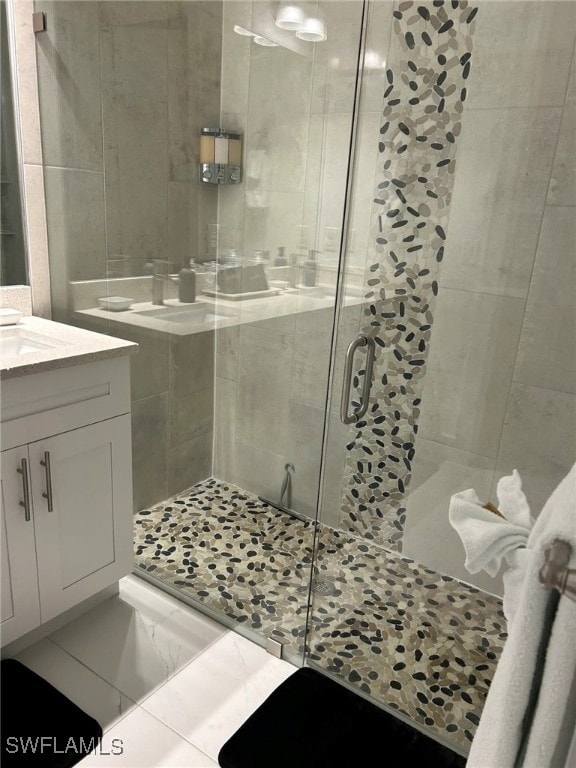 bathroom with vanity and walk in shower