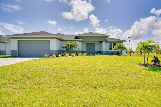 view of front of property with a garage and a front yard