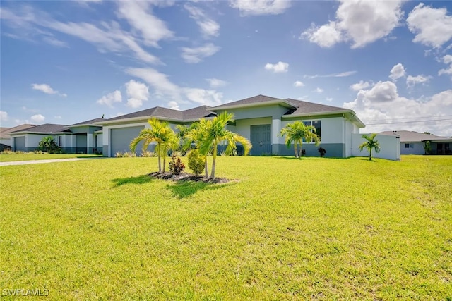 view of front of house with a front lawn and a garage