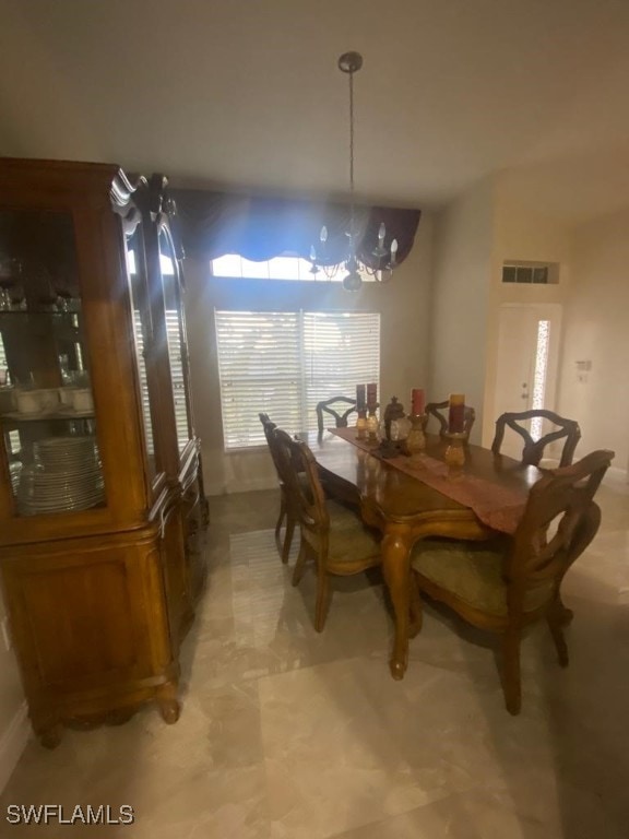 dining space with a chandelier