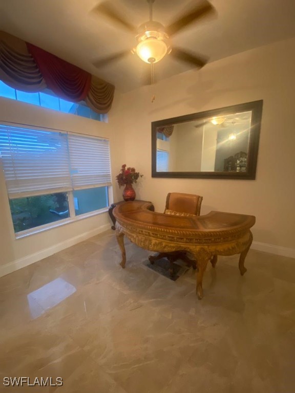 interior space featuring ceiling fan