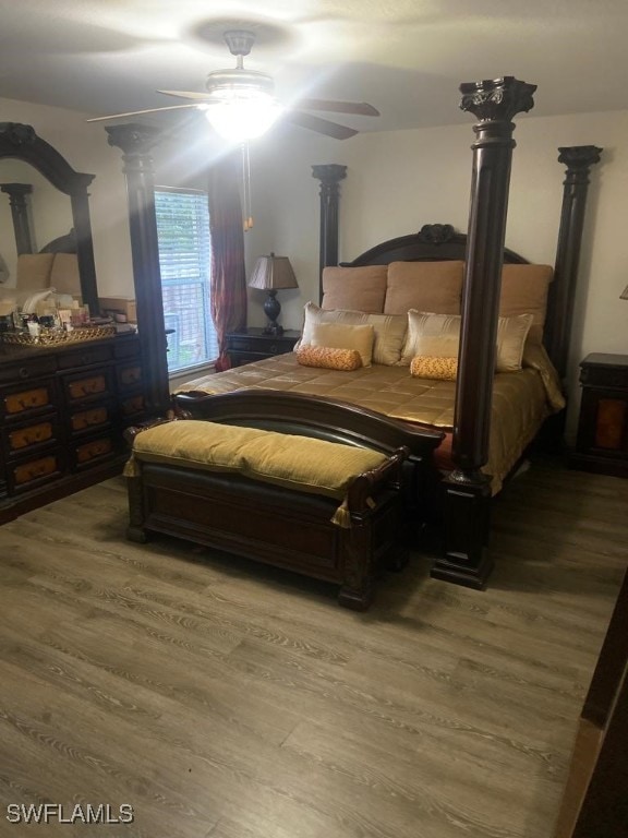 bedroom with ceiling fan and hardwood / wood-style flooring