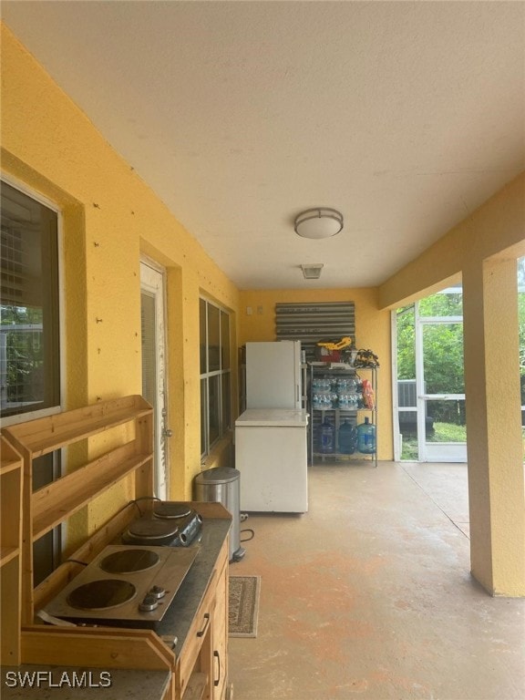 kitchen with white fridge and stovetop