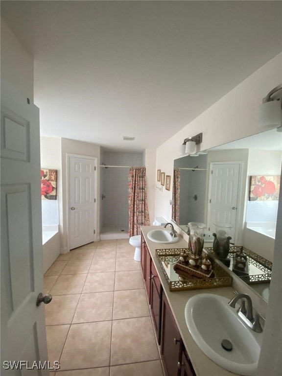 full bathroom featuring shower with separate bathtub, lofted ceiling, vanity, toilet, and tile patterned floors