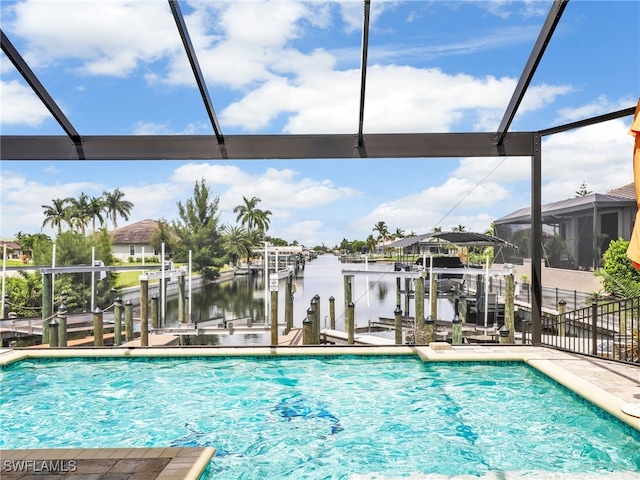 view of pool with a dock and a water view