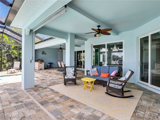 view of patio featuring ceiling fan, a lanai, an outdoor living space, and exterior kitchen