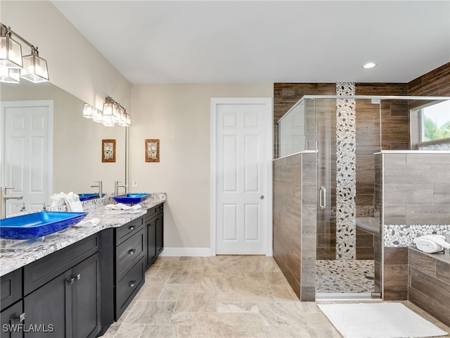 bathroom featuring an enclosed shower and vanity