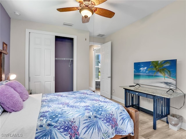 bedroom featuring light hardwood / wood-style floors, a closet, and ceiling fan