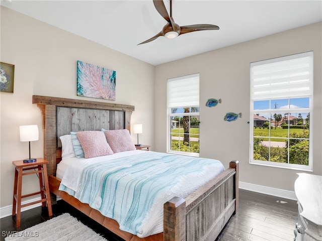 bedroom featuring dark hardwood / wood-style floors and ceiling fan