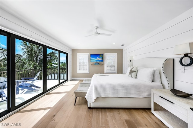 bedroom with ceiling fan, access to outside, and light hardwood / wood-style flooring