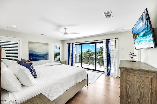 bedroom with access to exterior, ceiling fan, and wood-type flooring