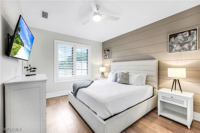 bedroom with ceiling fan and light wood-type flooring