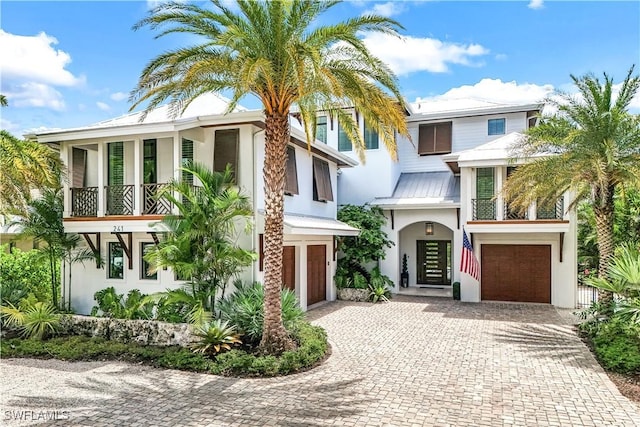 view of front of house with a balcony and a garage