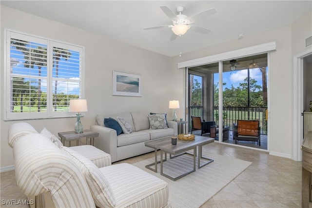 tiled living room featuring ceiling fan