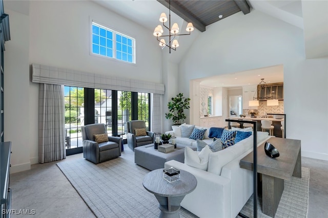 living room featuring high vaulted ceiling, a notable chandelier, and beamed ceiling