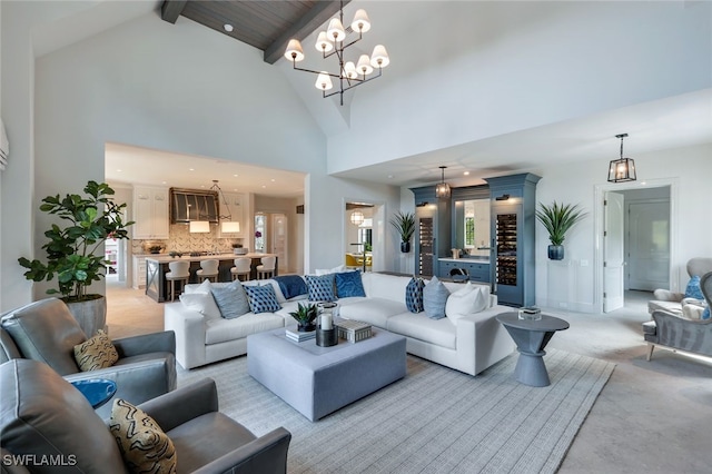 living room with light carpet, beam ceiling, and high vaulted ceiling